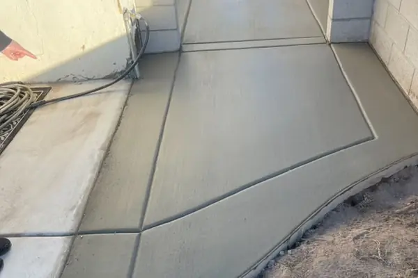 A jointed concrete side yard poured by our featured contractor